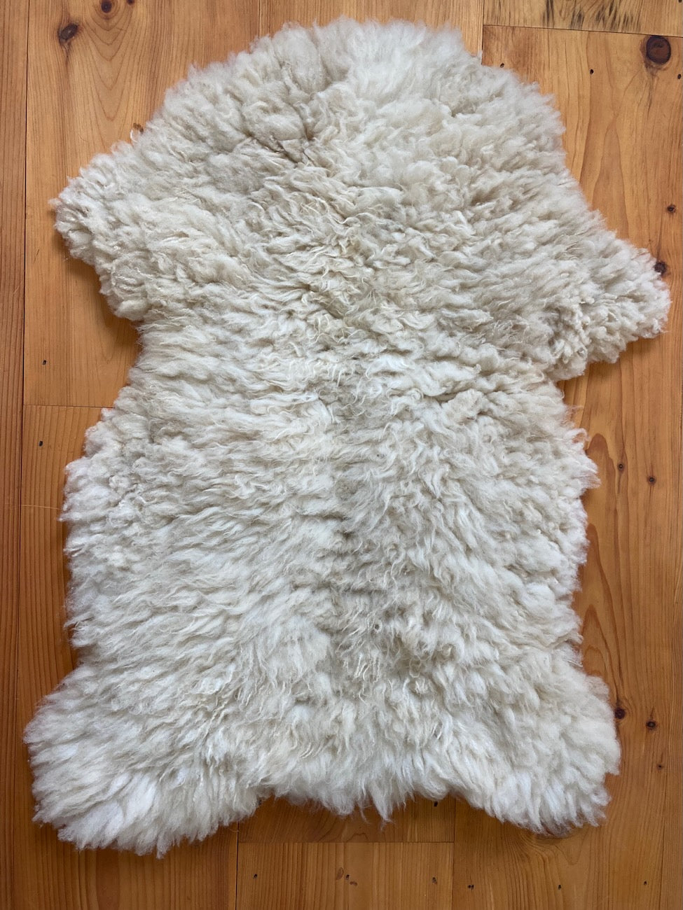 This fluffy white sheepskin is perfect for throwing over a chair or to put at the foot of your bed.